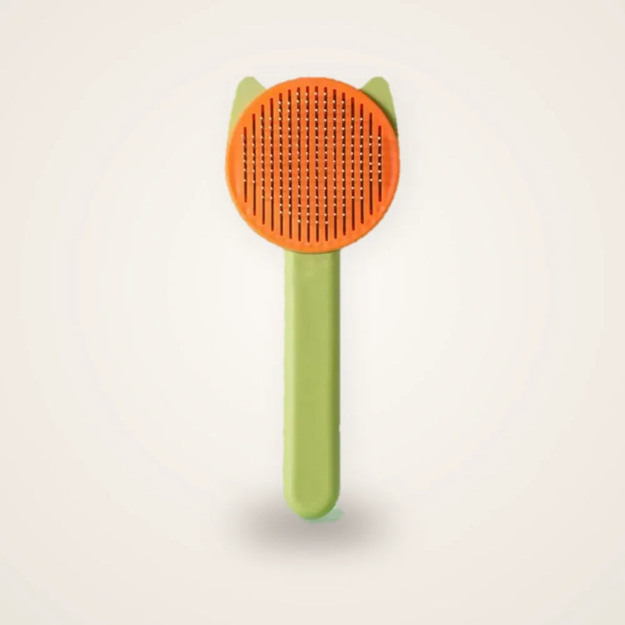 Brosse autonettoyante chat verte sur fond neutre
