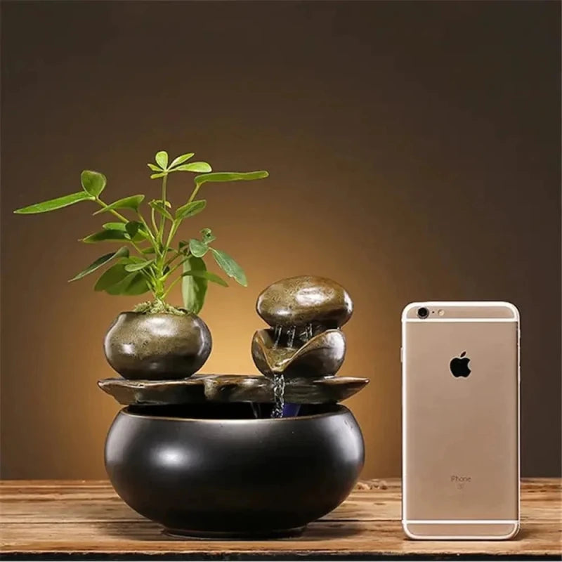 Taille de la fontaine à eau design Lunoa comparée à un smartphone